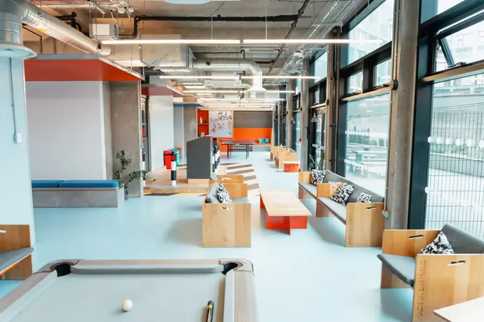 High shot showing pool area, seats and other communal areas.