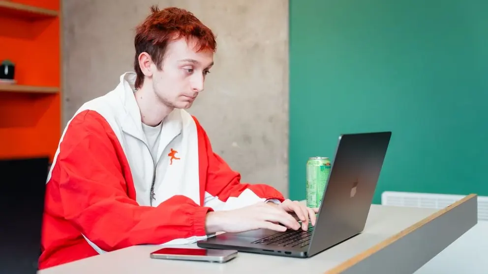 student completing work on computer.webp